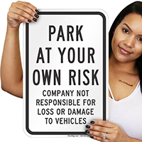 PARK AT YOUR OWN RISK Signs