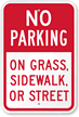 No Parking On Grass, Sidewalk Or Street Sign