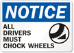 Notice Drivers Chock Wheels Sign