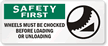 Safety First: Wheels Must Be Chocked Sign