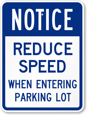 Notice reduce speed when entering a parking lot sign