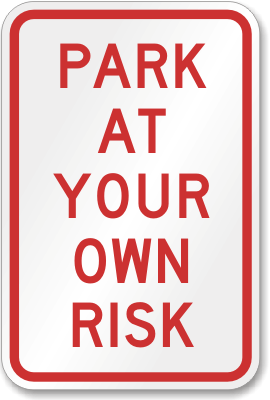 park at your own risk sign