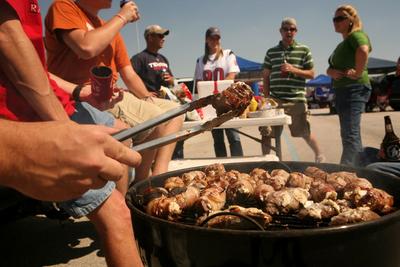 Tailgaters grill before a Cornhuskers game.
