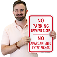 Bilingual No Parking Between Sign